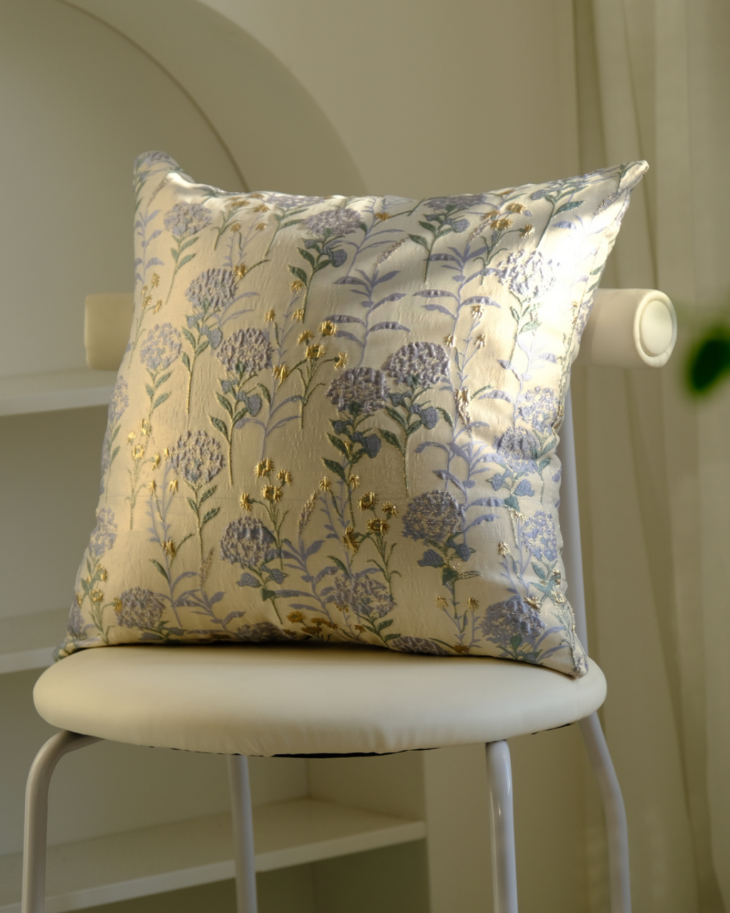 Blue floral cushion on a chair, vintage botanical style