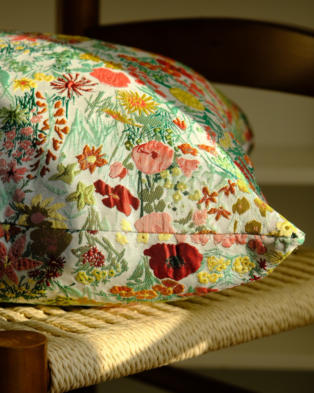 Close-up of dense multicolor wildflower print on cushion
