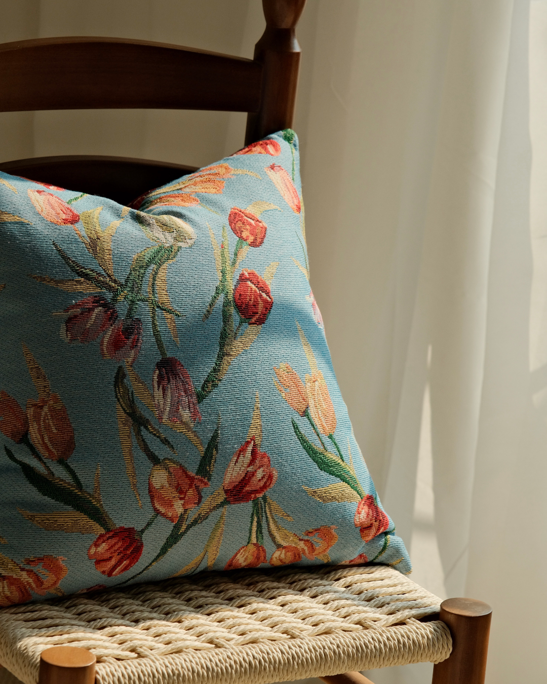 Textured tulip embroidered pillow cover on a chair
