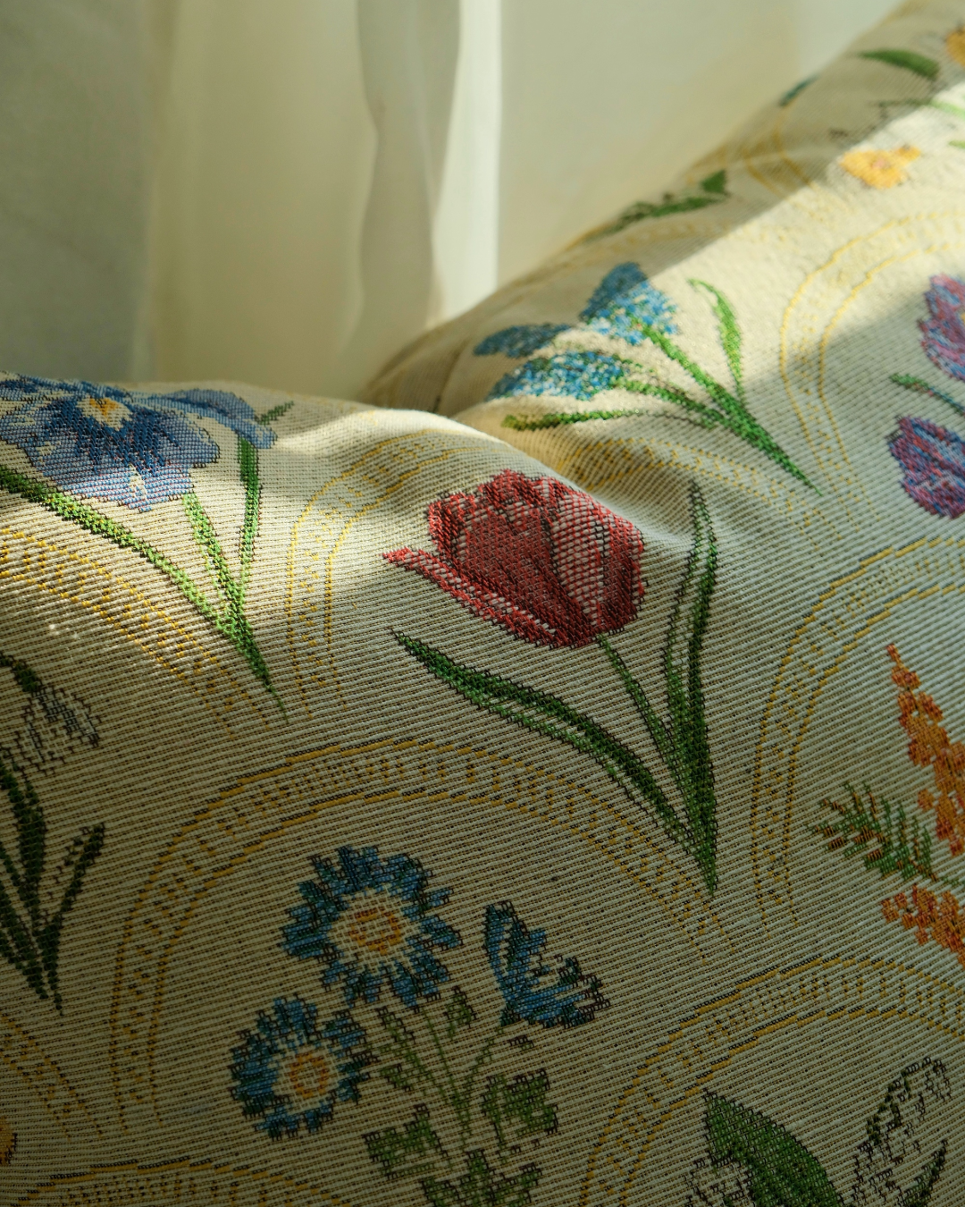 Close view of watercolor floral print on pillow cover fabric