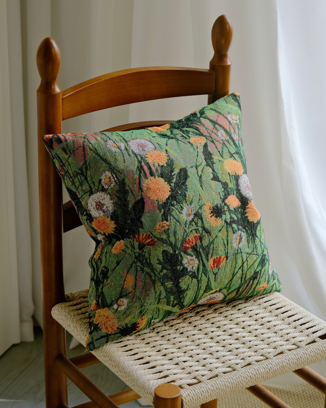 Wildflower meadow pillow cover on a chair showing full floral print