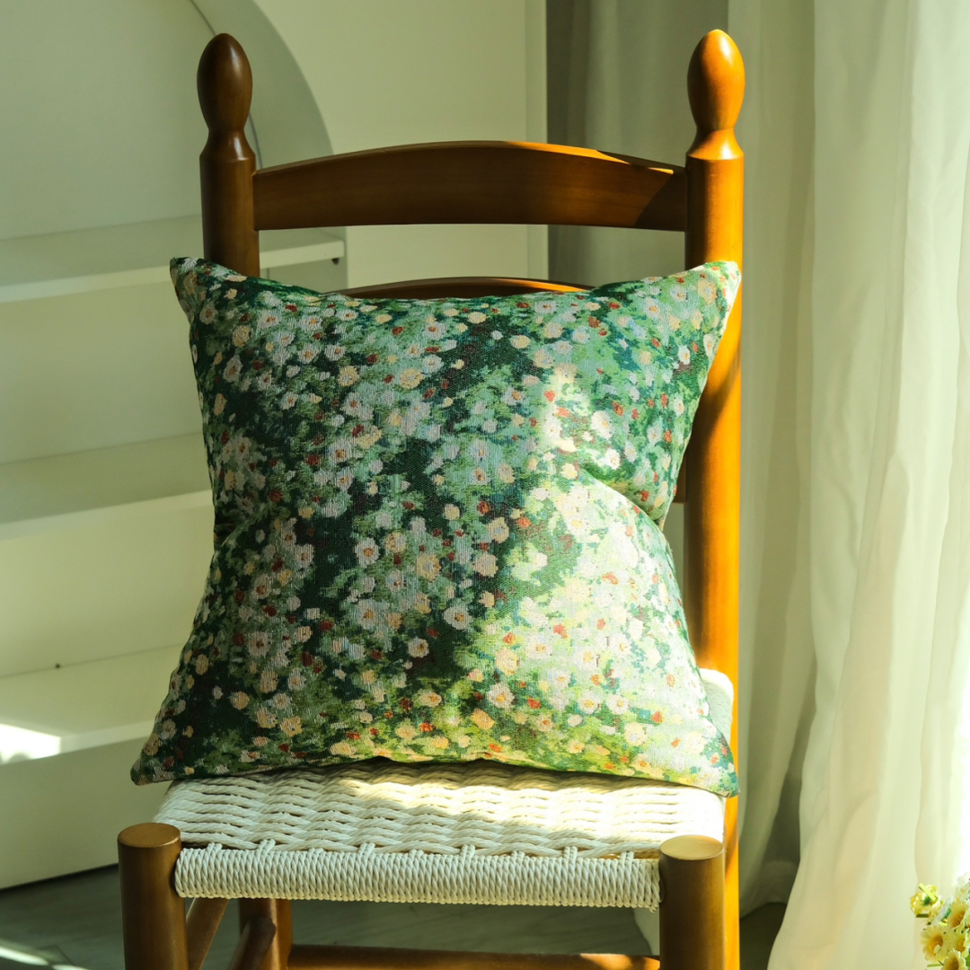 Floral cushion cover styled on the floor with natural sunlight