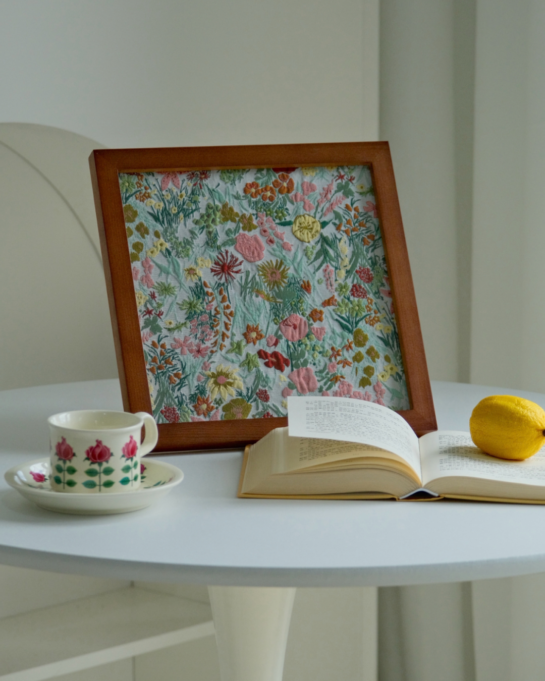 Botanical textile tabletop frame with colorful wildflowers