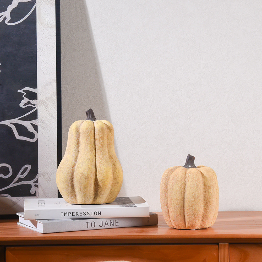 Yellow pumpkin ornament styled for autumn table decoration