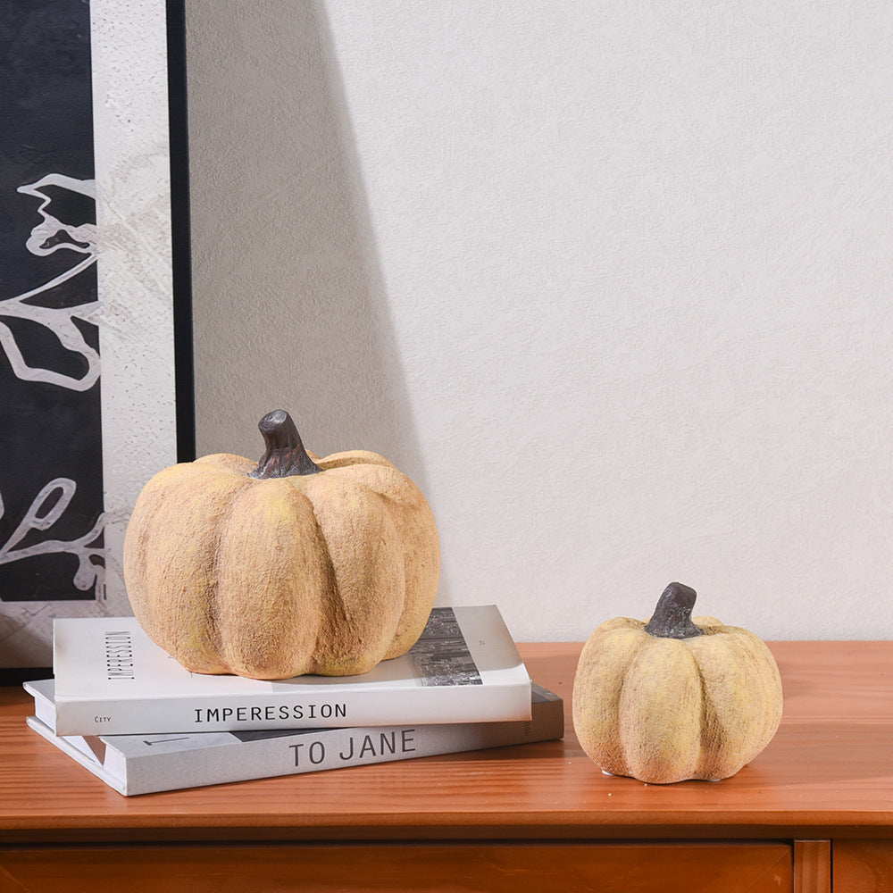 Minimalist yellow pumpkin decor on shelf and mantel