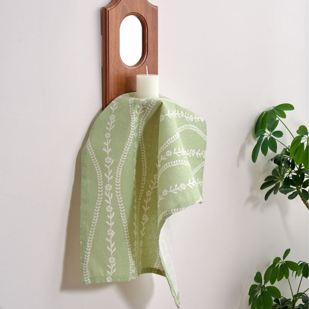 Soft sage green cloth napkin draping, light cotton