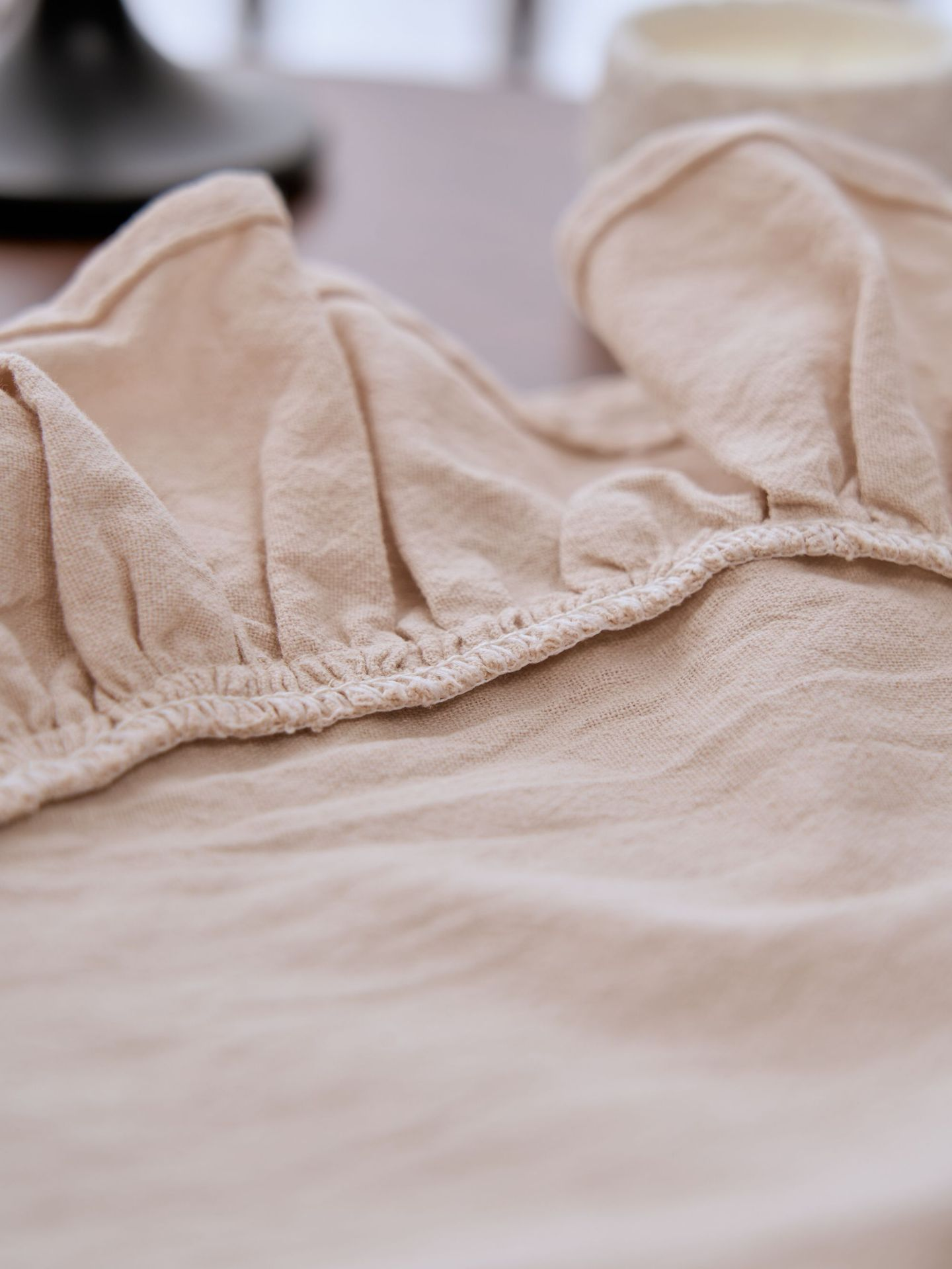 Close-up of beige fabric with a blurred background