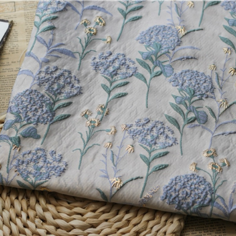 Close-up of raised hydrangea weave with metallic thread