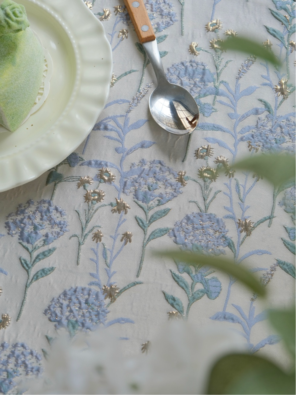 Close-up of raised hydrangea weave with metallic thread
