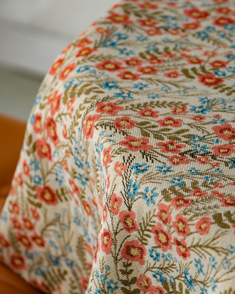 Close view of wildflower meadow print draped over table edge