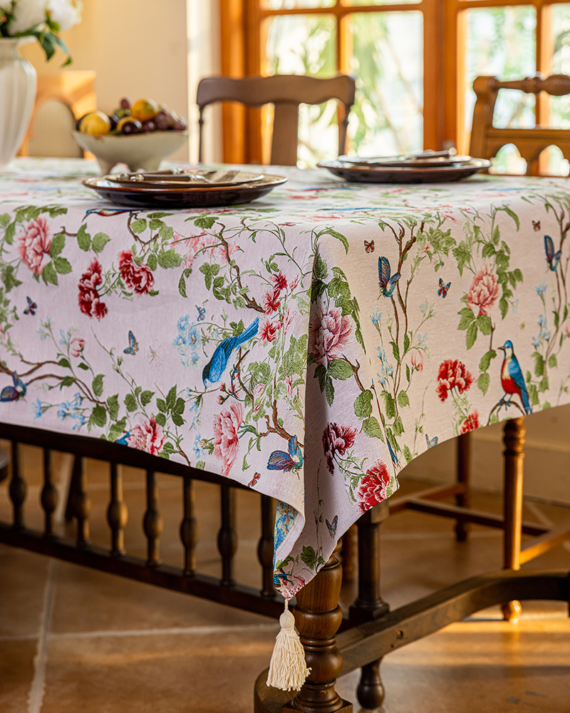 Rose Garden tablecloth on a long dining table set for a meal