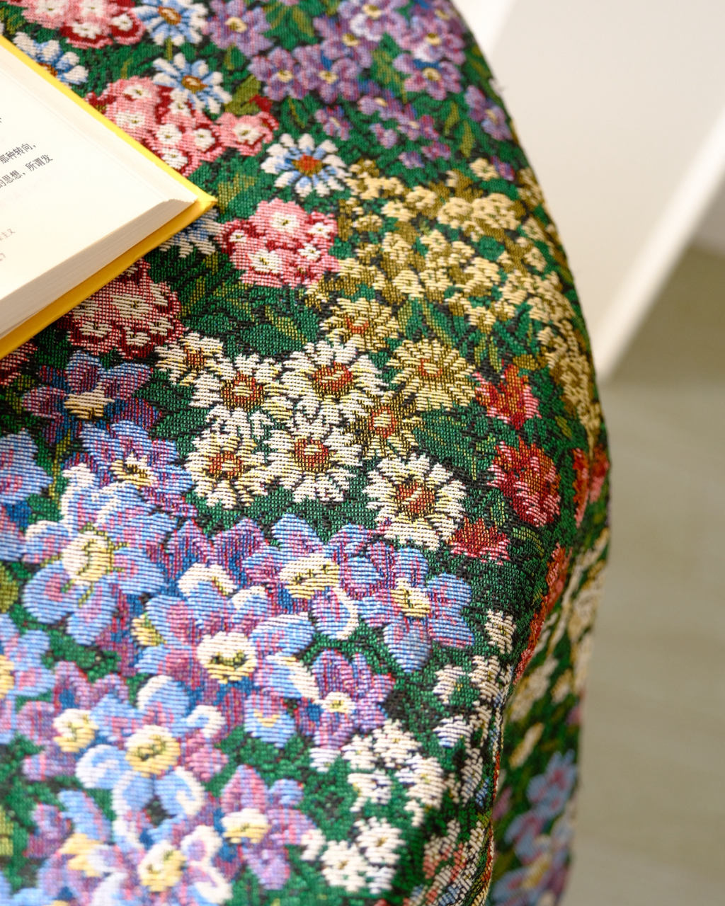 Dark floral meadow tablecloth close-up showing lilac and pink blossoms