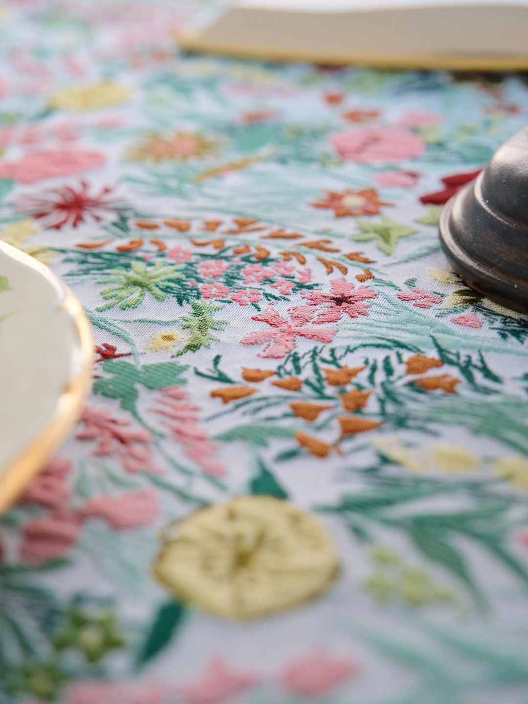 Close view of bright floral print with pink and yellow blossoms