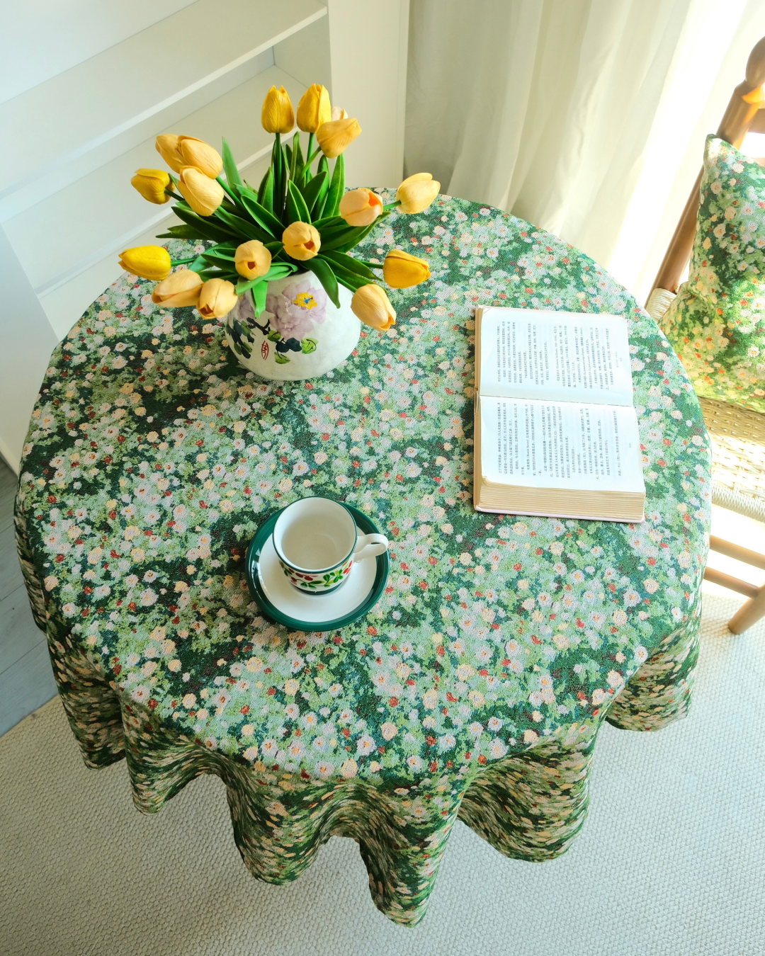 Green meadow floral tablecloth with white flowers on cottage dining table