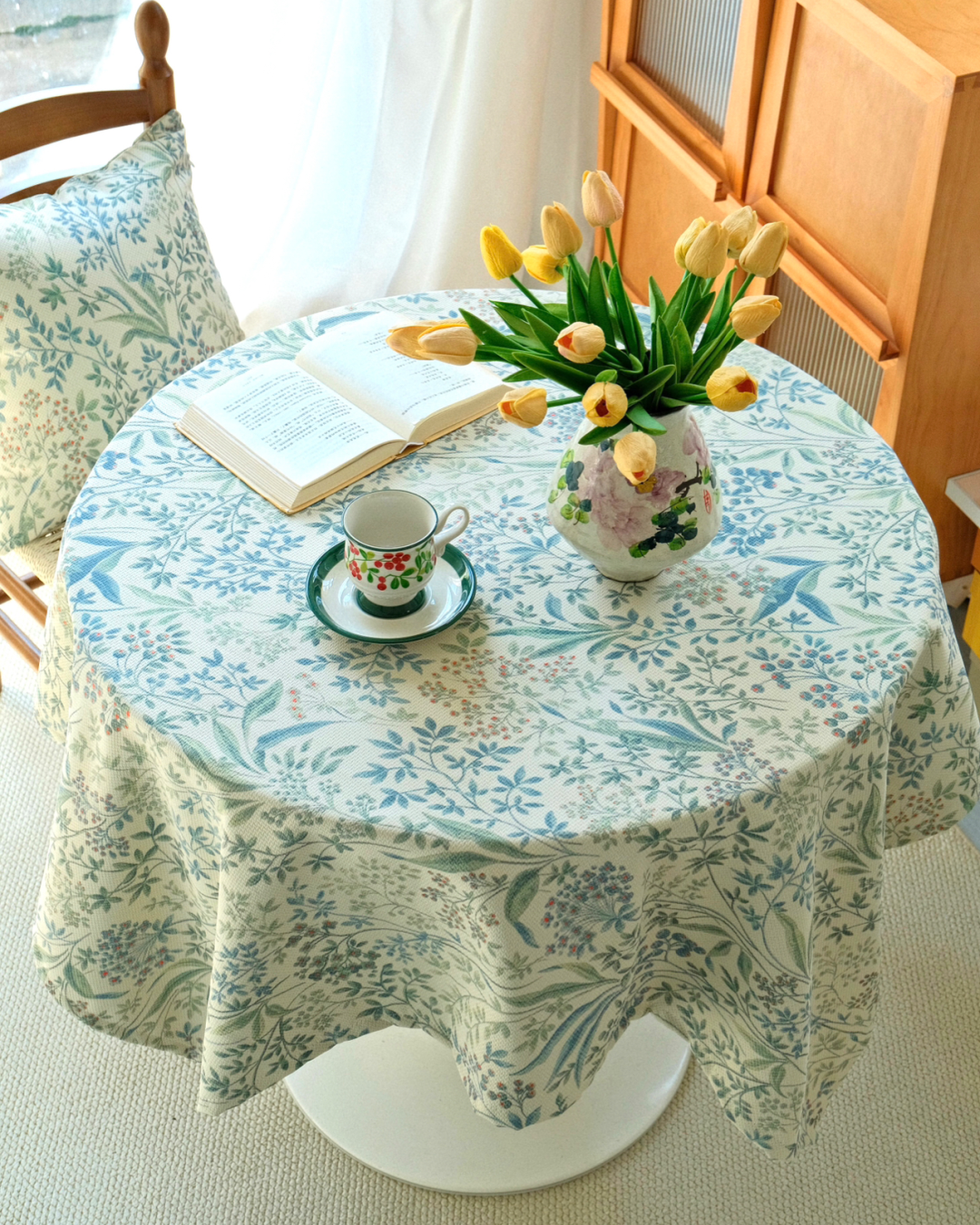 Botanical dining tablecloth styled with tea set and tulips