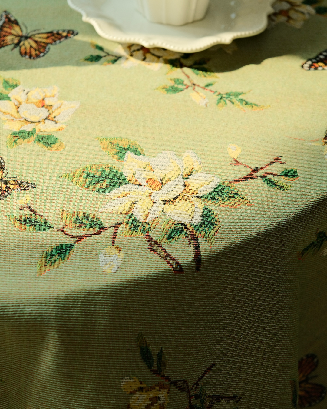 Nature-inspired floral tablecloth with butterfly details