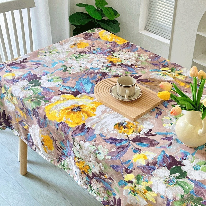 Colorful painterly floral polyester tablecloth on dining table