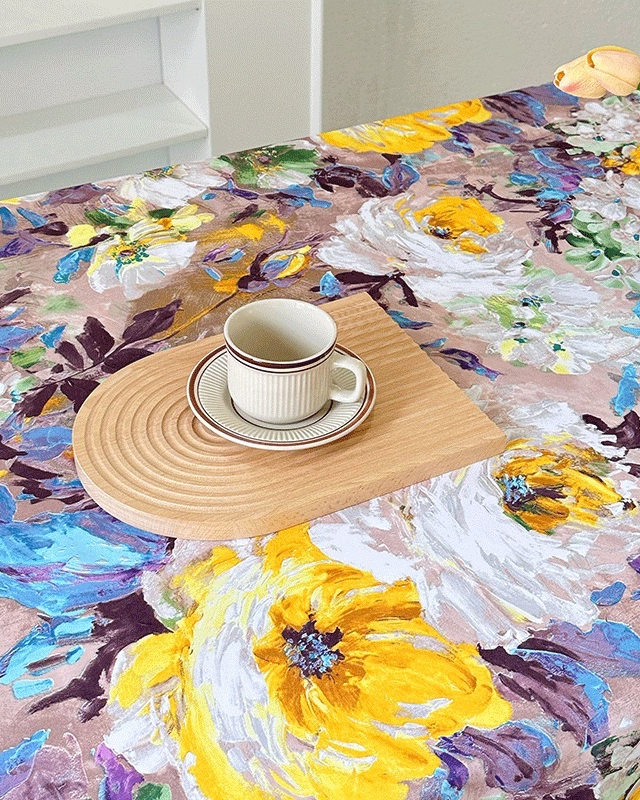 Close-up of painterly floral polyester tablecloth texture