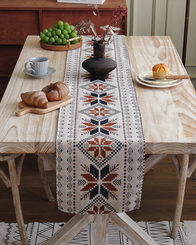 Nordic snowflake table runner on a wooden dining table