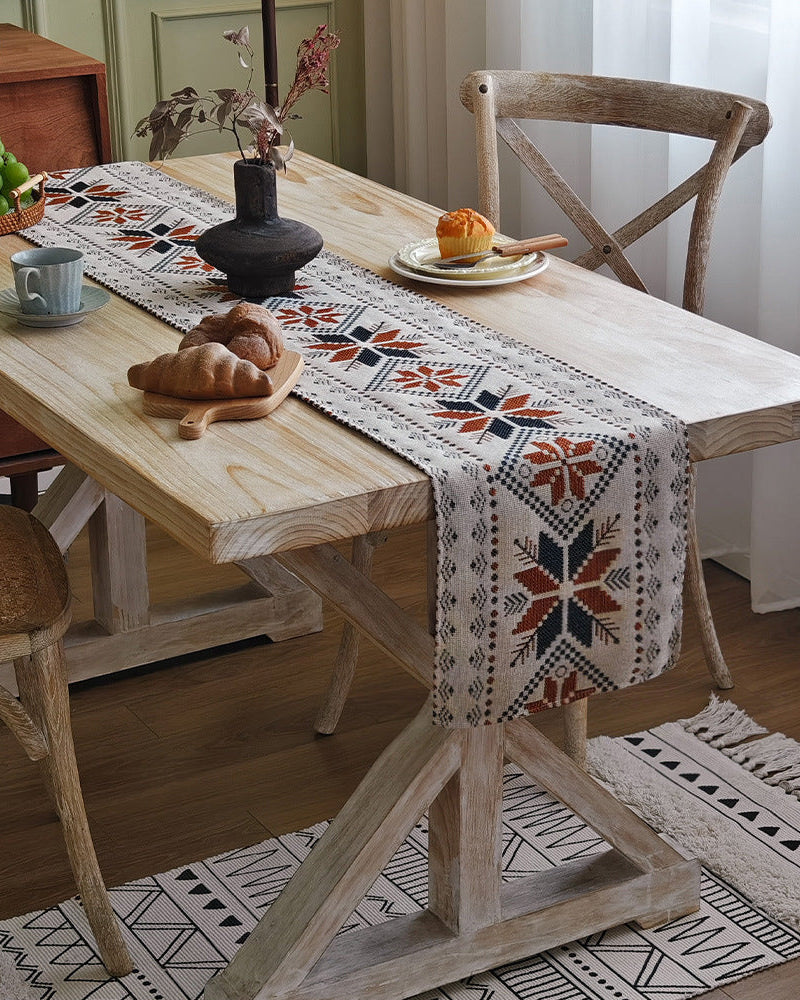 Fringed edge of a Nordic snowflake boho table runner