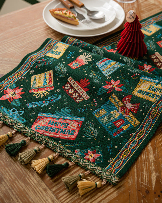 Multi-tone tassel edge of a festive Christmas table runner