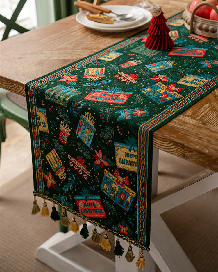 Decorative table runner with colorful designs on a wooden table.