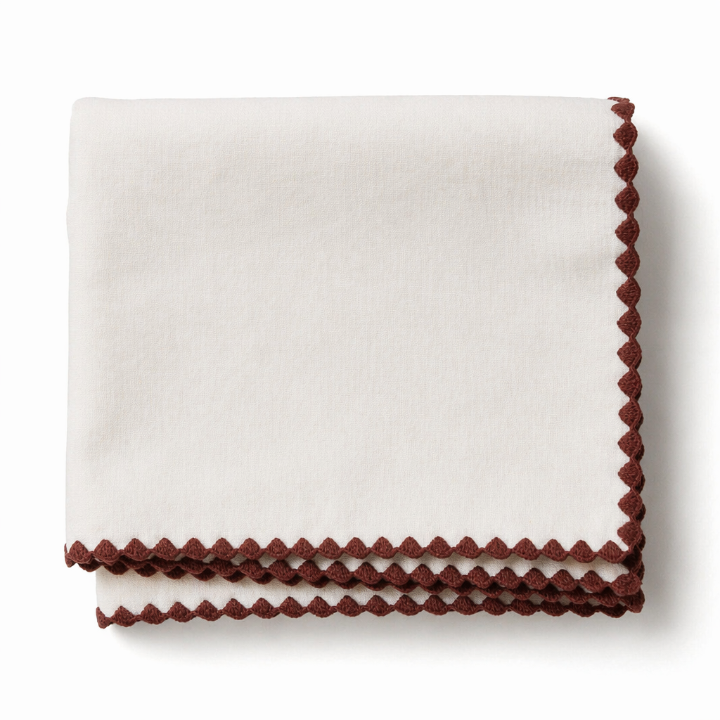 Cream cotton table runner with terracotta crochet scalloped trim