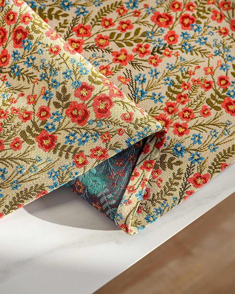 Close view of red floral print on table runner